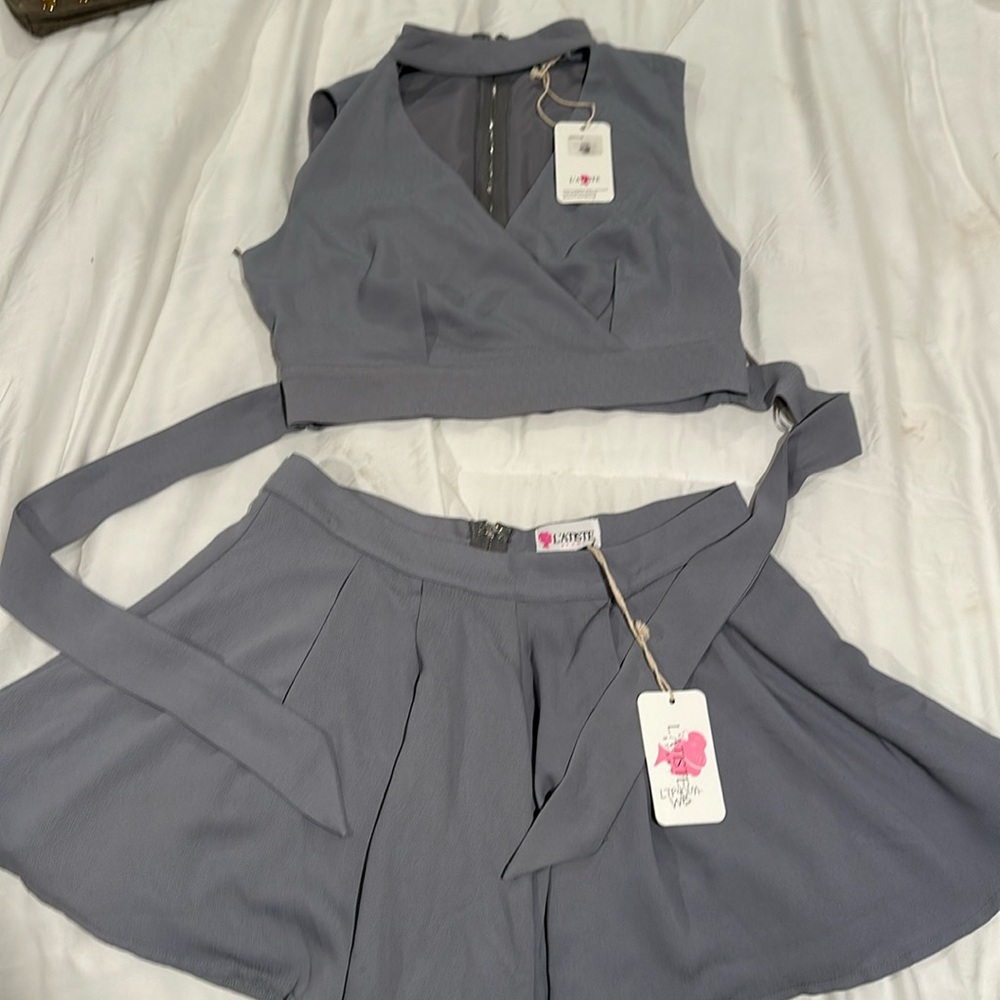 L’Atiste set with fuller short bottoms and high neck top. NWT